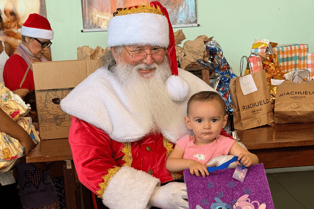Banner do evento Papai Noel presenteia crianças carentes!